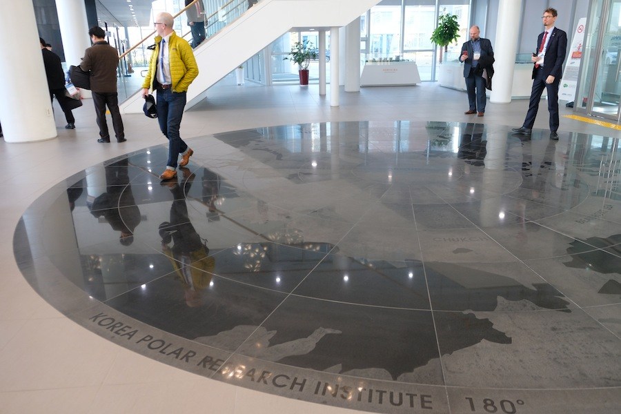 KOPRI’s grand lobby with maps of the Arctic and Antarctic laid out in floor mosaics. (Mia Bennett/Cryopolitics)