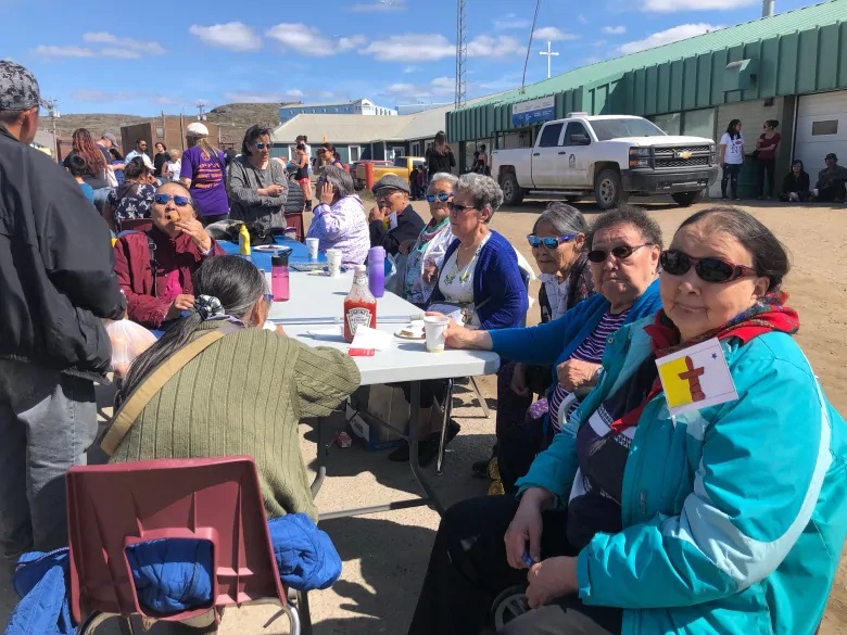 People soak up the sunshine in Iqaluit as Nunavut celebrates 26 years since the Nunavut Land Claims Agreement Act went into effect. (Madeleine Allakariallak/CBC)