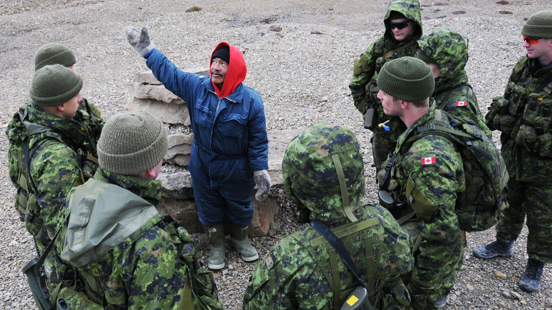 Paul Atagoota of 1 Canadian Ranger Patrol Group shares his knowledge about Inukshuks with the soldiers of 32 Brigade in Resolute Bay, Nunavut, during the 2010 iteration of Operation Nanook, a recurring Canadian Forces operation that takes place in northern Canada. (Sgt Marco Comisso/Canadian Armed Forces)