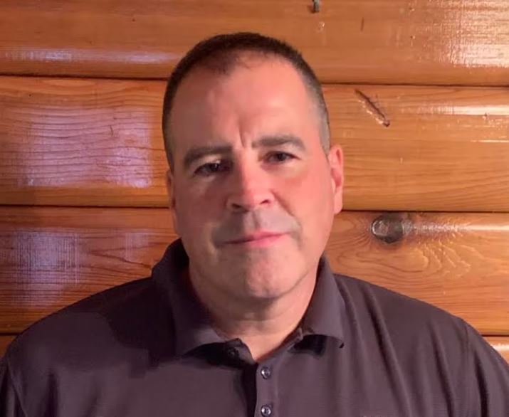 Mayo Mayor Trevor Ellis stands in front of a wall