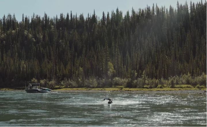 A man swims in the water.