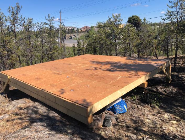 A tent platform in the woods