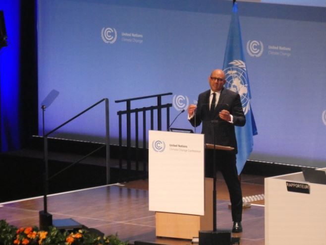 UN Climate Change Executive Secretary Simon Stiell talks on stage.