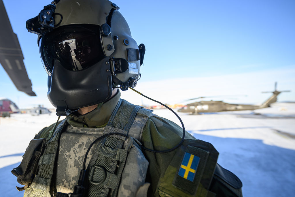 A file photo of a member of the flight crew waiting for his Blackhawk UH-60 helicopter during the Nordic Response military exercise on March 07, 2024 in Kiruna, Sweden. 