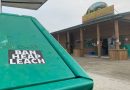 A sticker on a garbage can outside of a rural store reads, 'Ban heap leach.'