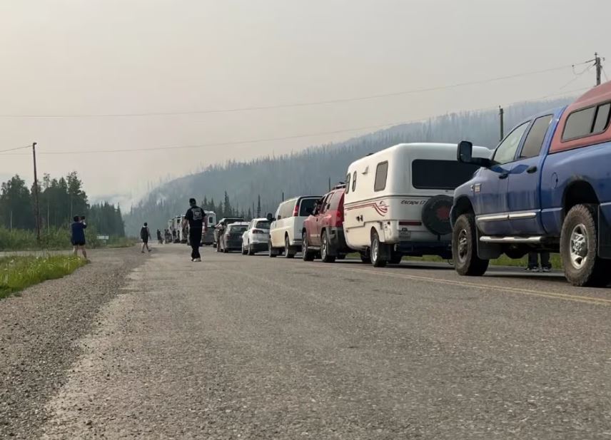 Line of cars on road.