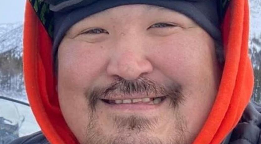 A man, smiling.