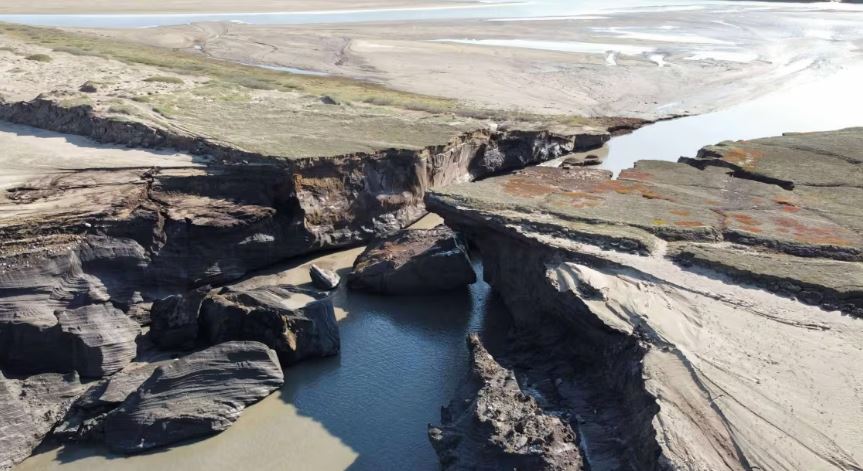 A drainage channel into a northern river.