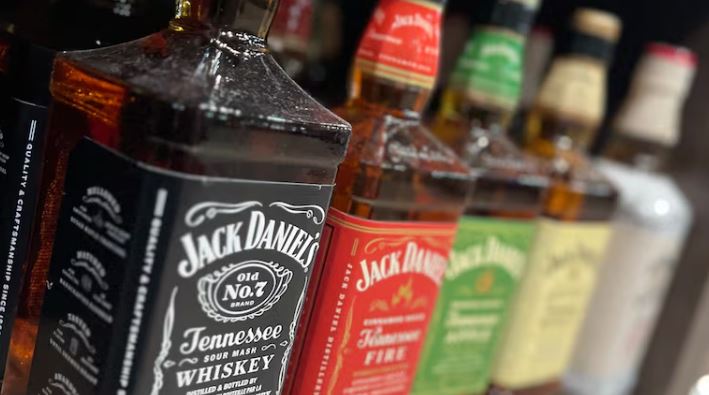 Bottles of whiskey on a store shelf.