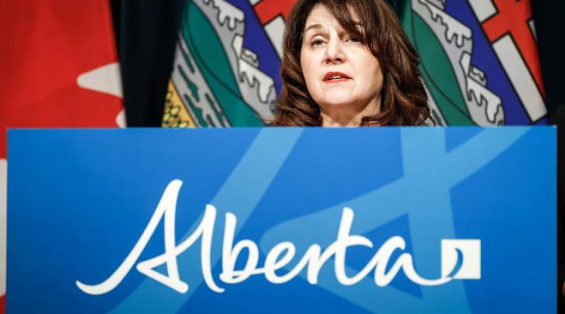 A woman at a podium. Alberta Minister of Health Adriana LaGrange pictured last February.