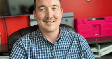 A man smiling on the camera