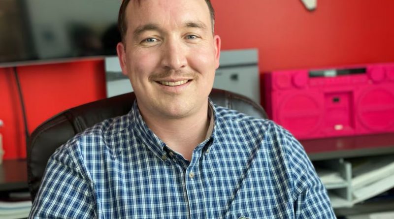 A man smiling on the camera