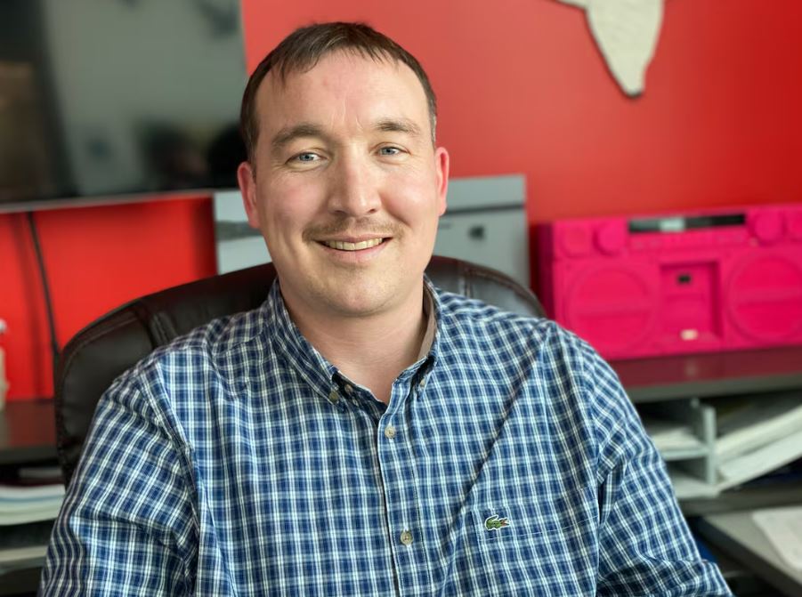 A man smiling on the camera