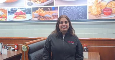 Satwant (Sweets) Kaur Dhillon, Owner of Ricky's Yellowknife stands at the restaurant