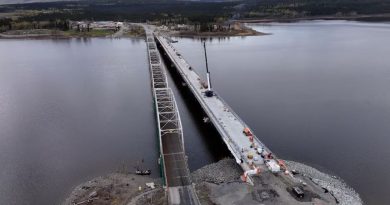 Two bridges, one under construction, seen from the air.