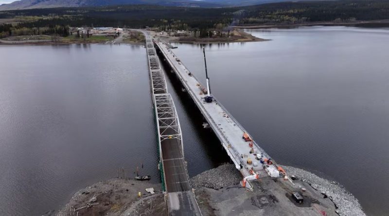 Two bridges, one under construction, seen from the air.
