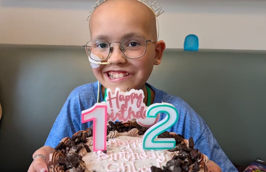 A little girl with a birthday cake