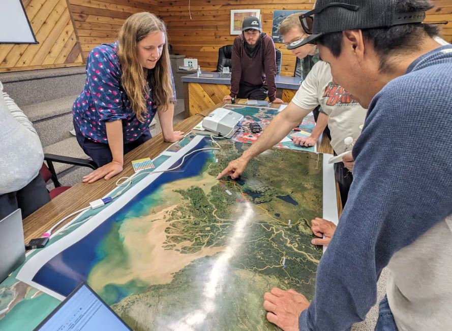 People standing around a map