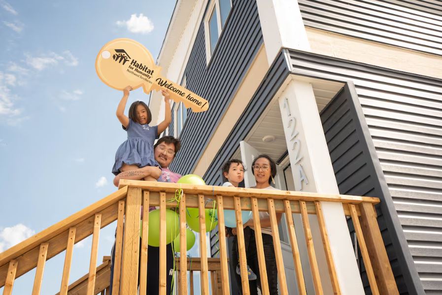 Parent's Gabe and Jennifer and their two children were among four families who moved into Habitat For Humanities 11th build in Yellowknife this past weekend.