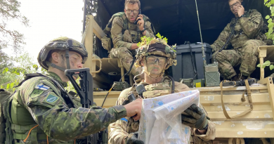 Military men looking at a map
