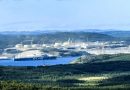 Gas reservoir tanks in front of mountains