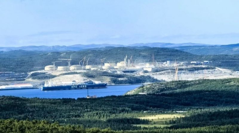 Gas reservoir tanks in front of mountains