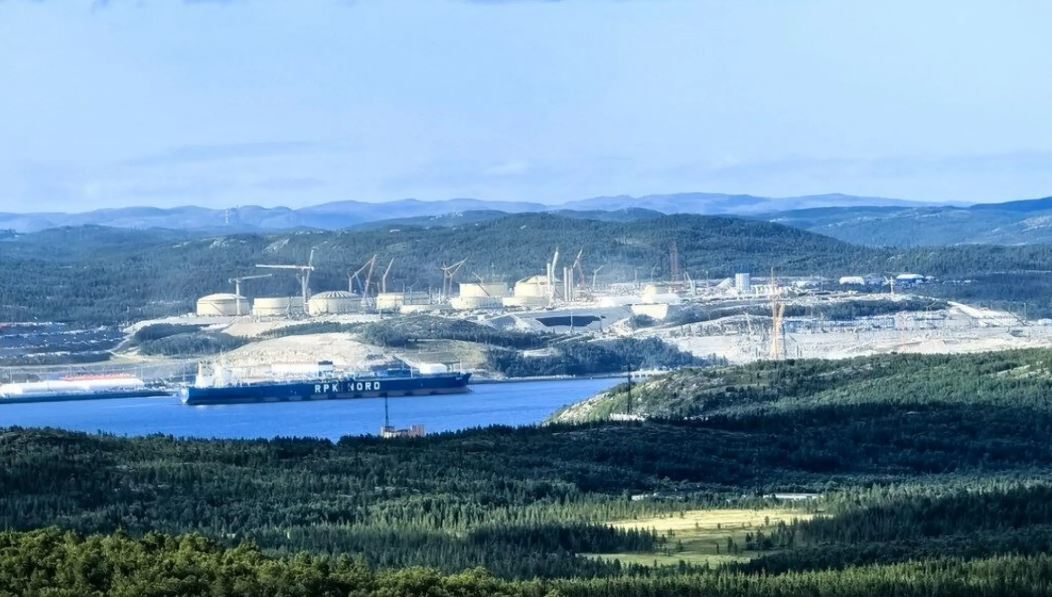 Gas reservoir tanks in front of mountains