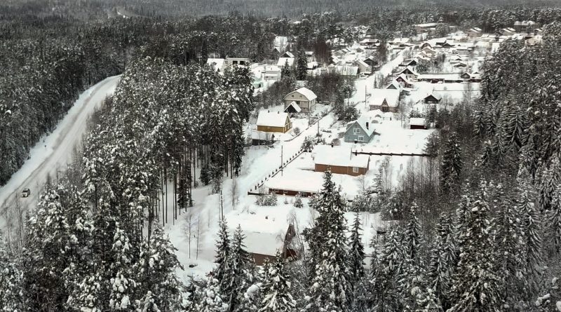 Snow coats the village of Ikhala in Russia’s Karelia region, Tuesday, Feb. 16, 2021. Russia’s rollout of its coronavirus vaccine is only now picking up speed in some of its more remote regions, although experts say the campaign is still moving slowly. (AP Photo/Kirill Zarubin)