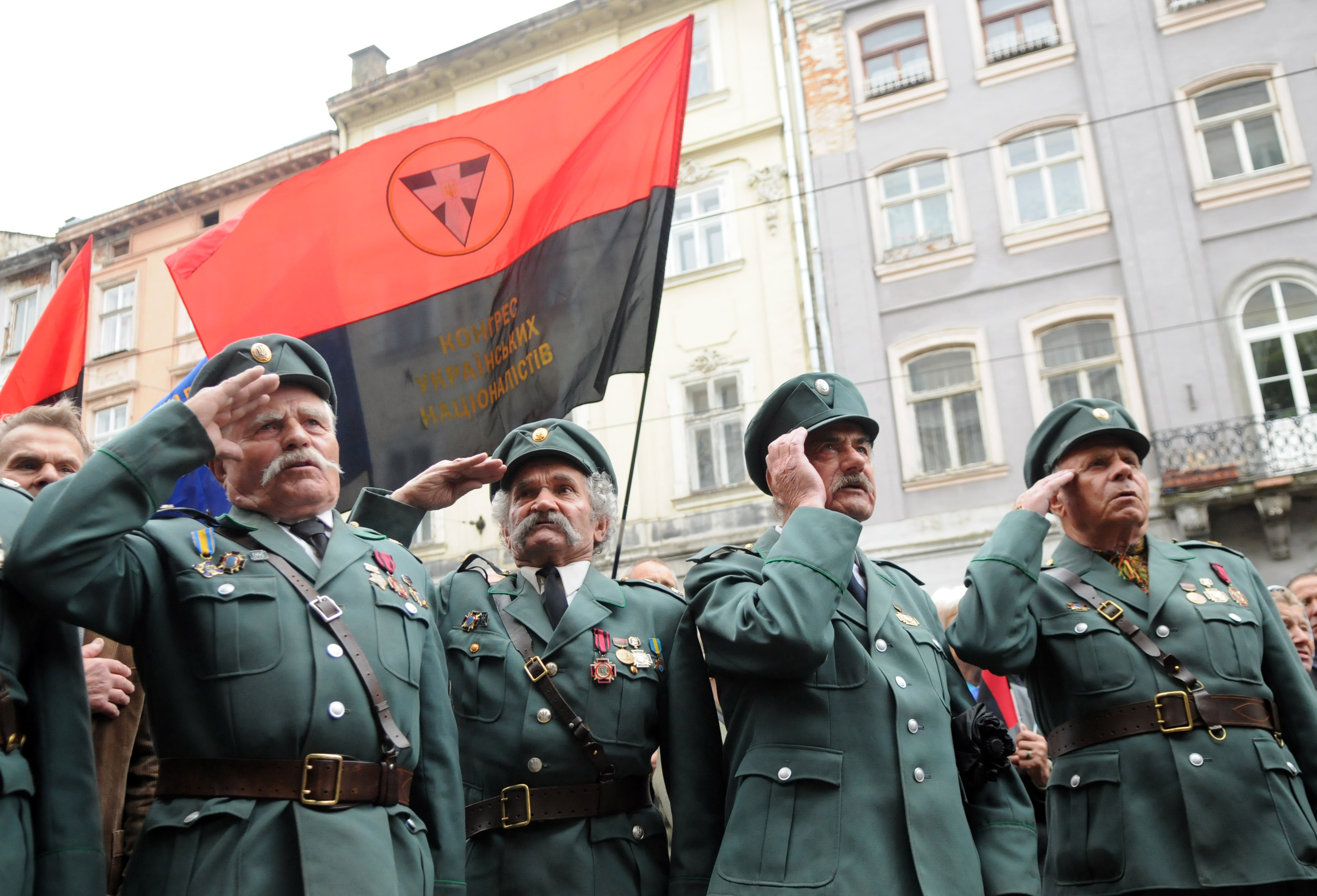 Veterans of Ukrainian Insurgent Army ( or UPA) salute during a cermony marking 103rd anniversary of Roman Shukhevych birthday in Lviv on June 27, 2010. Shukhevych ( 1907 1950) was a Ukrainian politician and military leader, the leader of the Ukrainian Insurgent Army, a Ukrainian nationalist partisan army that engaged in a series of guerrilla conflicts during World War II against Nazi Germany, the Soviet Union, Czechoslovakia, and Poland. The World War II figure symbolizes the deep divides of the country seeking an identity. AFP PHOTO / YURIY DYACHYSHYN (Photo credit should read YURIY DYACHYSHYN/AFP/Getty Images)