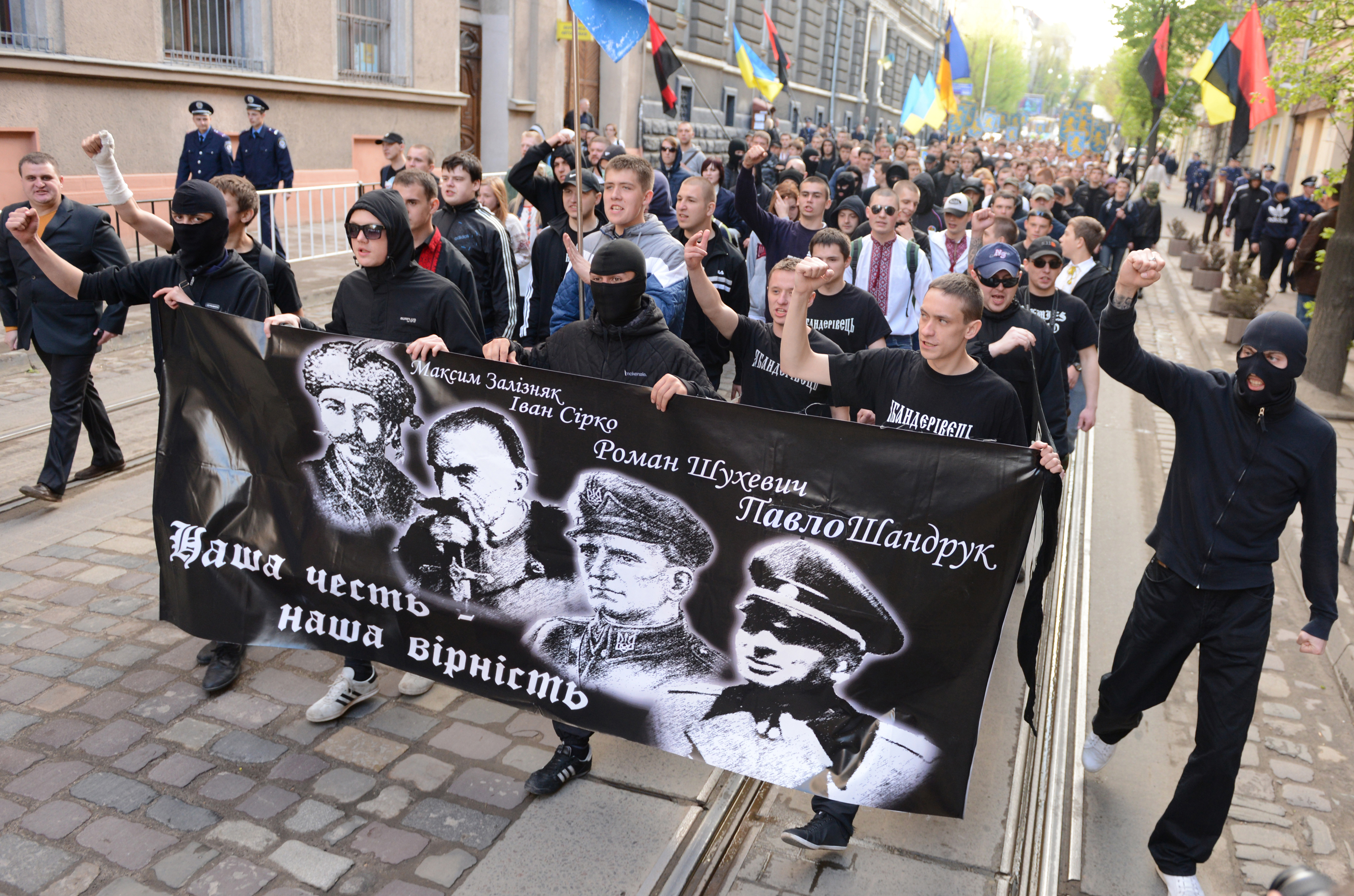 Ukrainian ultra-nationalists march in the center of the western city of Lviv on April 28, 2013 to mark 70th anniversary of 14th SS-Volunteer Division "Galician" foundation. The 14th Waffen Grenadier Division was a World War II German military formation initially made up of volunteers from the region of Galicia with a Ukrainian ethnic background, but later also incorporated Slovaks, Czechs and Dutch volunteers and officers. Neo-nazis from Russia and Lithuania also took part in the march. AFP PHOTO/ YURIY DYACHYSHYN (Photo credit should read YURIY DYACHYSHYN/AFP/Getty Images)