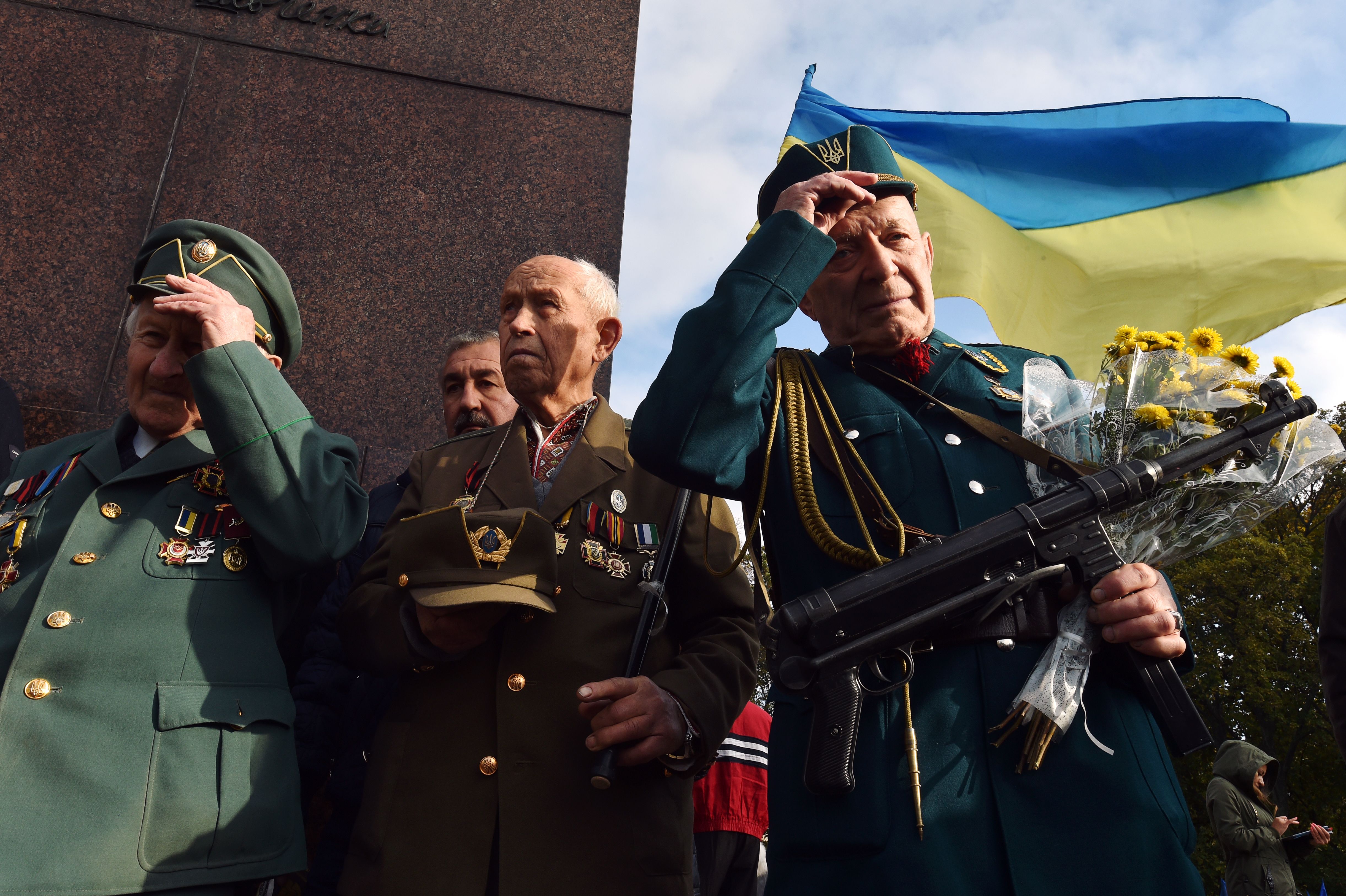 Veterans of the Ukrainian Insurgents Army (UPA) take part in a rally in Kiev on October 14, 2016 to celebrate the Defender of Ukraine Day and the creation of the paramilitary partisan movement Ukrainian Insurgent Army (UPA), aimed at fighting for independence against Polish, Soviet and German forces in western Ukraine. / AFP / GENYA SAVILOV (Photo credit should read GENYA SAVILOV/AFP/Getty Images)