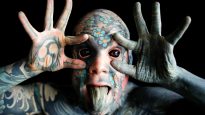 2020-09-28T103748Z_186108223_RC2M7J9SS6DK_RTRMADP_3_FRANCE-TATTOO-TEACHER