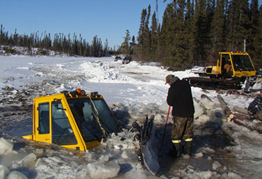 This tractor specializes in snow removal from ice roads. It lost control in northern Ontario in January 2013. The two men on board came very close to losing their lives. (Kitchenuhmaykoosib Inninuwug)