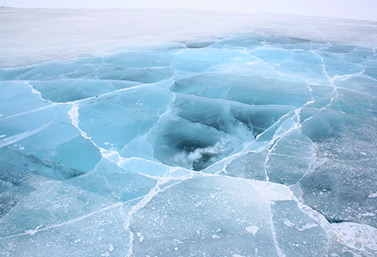 A section of ice road in northern Canada. The colors of ice give important clues to its strength. (Ian Mackenzie)