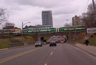 An afternoon GO Train runs through a Toronto suburb in April (Joe Fiorino/CBC) 