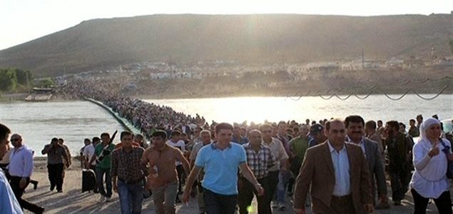 Des réfugiés syriens traversent le Tigre pour atteindre le Kurdistan irakien Photo : Reuters