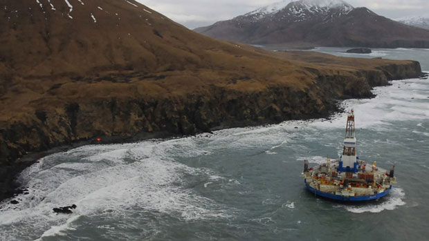 The conical drilling unit Kulluk, sitting grounded 60 kilometres southwest of Kodiak City, Alaska, on Thursday. (U.S. Coast Guard, Petty Officer 2nd Class Zachary Painter/Associated Press )